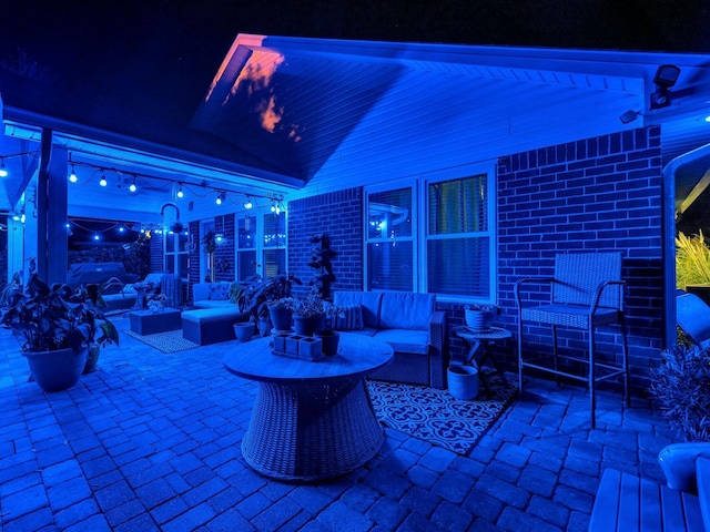 patio at night with an outdoor hangout area