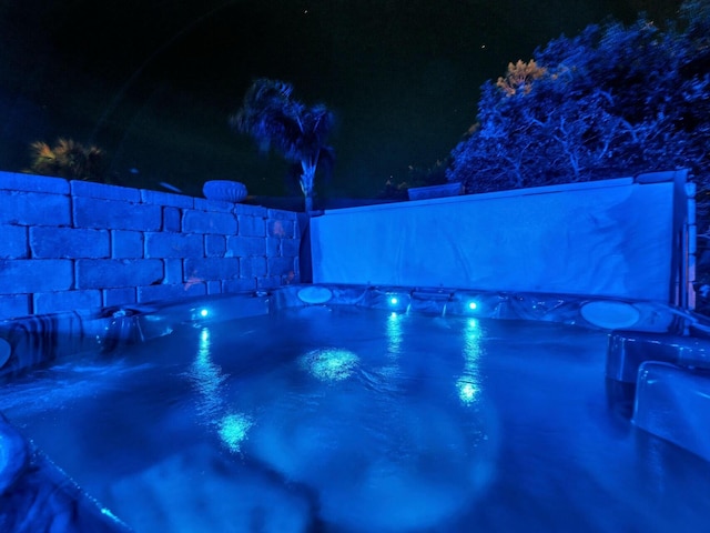 view of pool at night