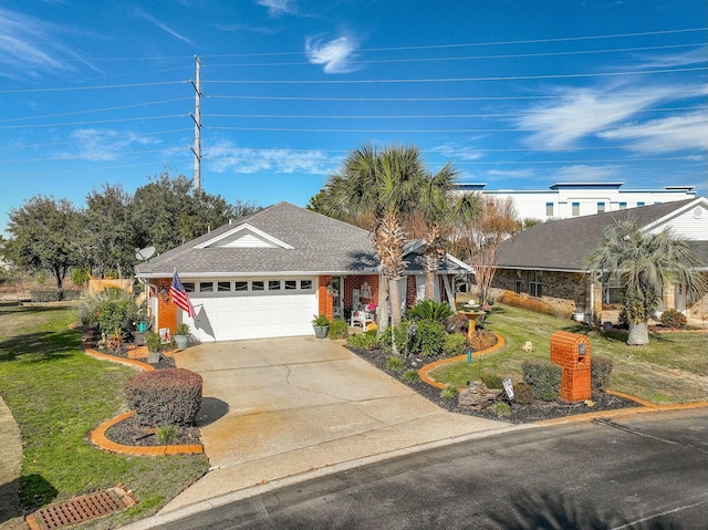 view of front of house featuring a garage and a front lawn