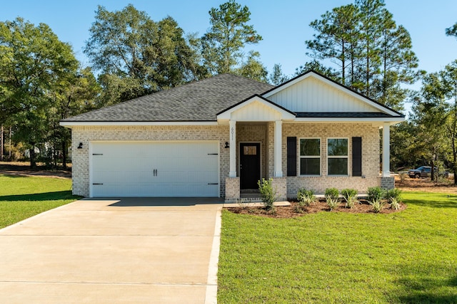 craftsman-style house featuring a garage and a front lawn