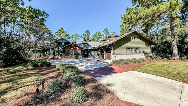 view of front of home with a front lawn and a carport