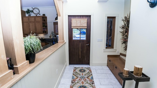 tiled entryway featuring sink