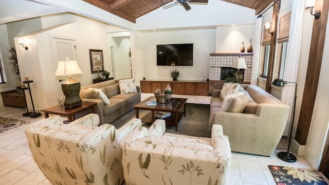 living room with a fireplace, lofted ceiling with beams, ceiling fan, and wooden ceiling