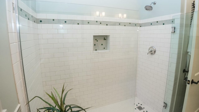 bathroom with a tile shower