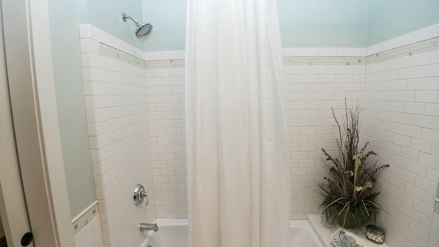 bathroom featuring shower / bath combination with curtain