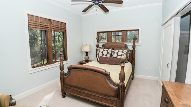 bedroom with ceiling fan, ornamental molding, light carpet, and multiple windows