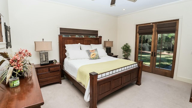 carpeted bedroom with ceiling fan, access to exterior, ornamental molding, and french doors