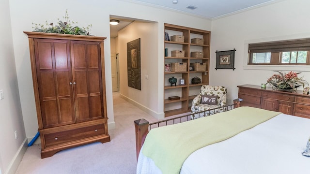 bedroom featuring light colored carpet and crown molding