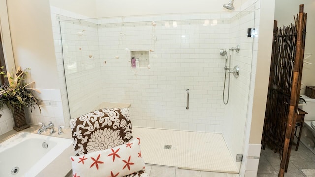 bathroom featuring tile patterned flooring and plus walk in shower