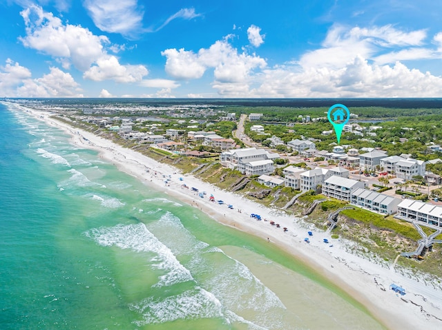 drone / aerial view featuring a water view and a beach view