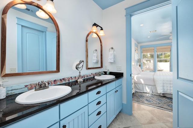 bathroom with ceiling fan and vanity