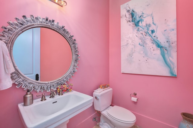 bathroom with toilet and sink