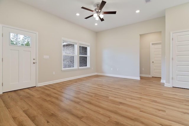 entryway with ceiling fan and light hardwood / wood-style flooring