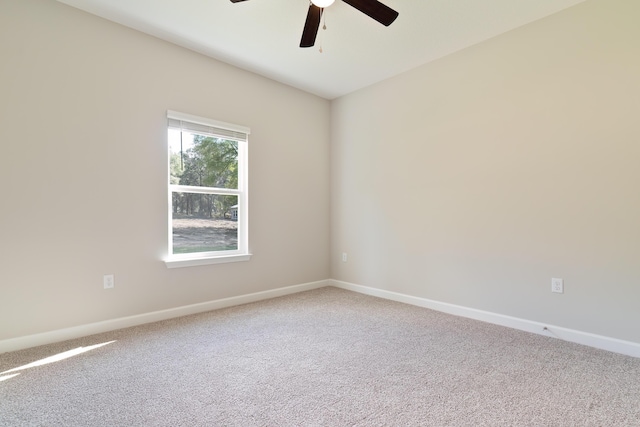 spare room featuring ceiling fan and carpet flooring