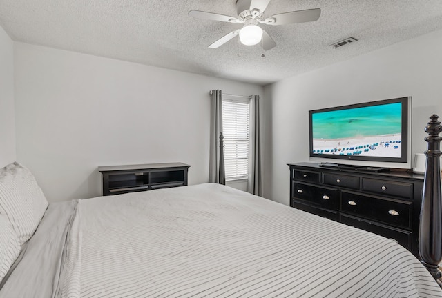 bedroom featuring a textured ceiling and ceiling fan