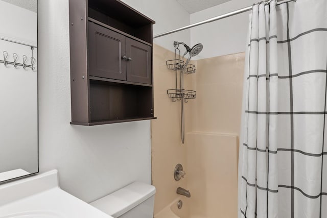 bathroom featuring shower / bath combination with curtain, a textured ceiling, and toilet