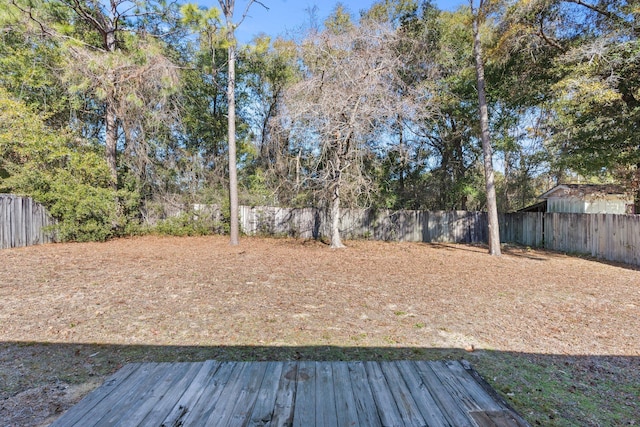 view of yard with a wooden deck