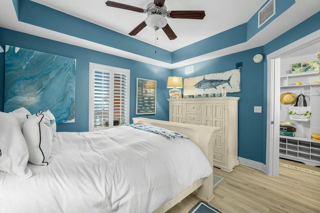 bedroom featuring ceiling fan and light hardwood / wood-style flooring