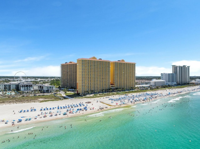 drone / aerial view with a beach view and a water view