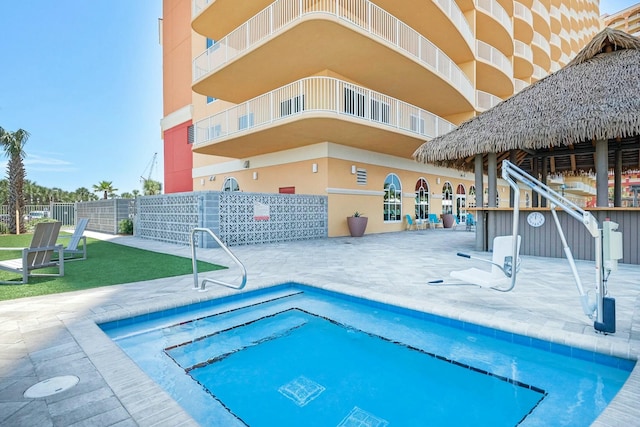 view of swimming pool with a patio