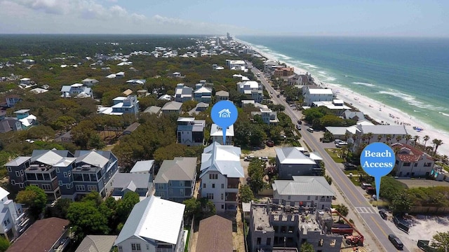 aerial view featuring a water view and a beach view