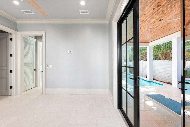 interior space with french doors and crown molding