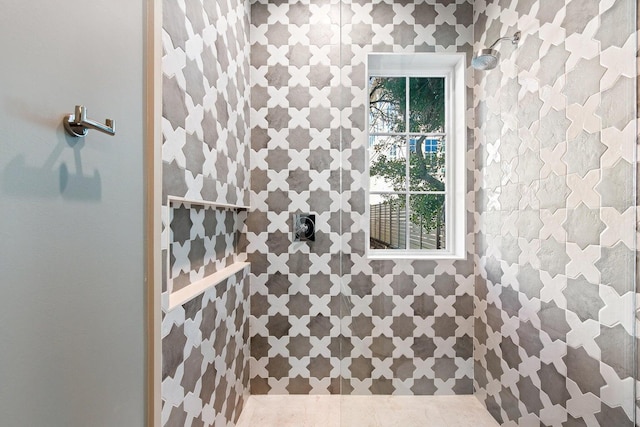 bathroom featuring tile patterned flooring and walk in shower