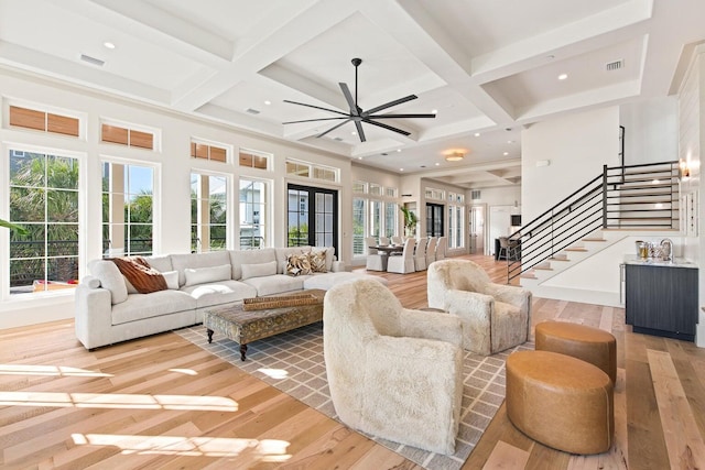 29 Thyme St, Santa Rosa Beach, FL 32459 - living area with stairway, healthy amount of natural light, coffered ceiling, ceiling fan, and light wood-style floors