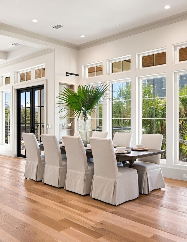 29 Thyme St, Santa Rosa Beach, FL 32459 - dining space with crown molding, light wood-type flooring, french doors, and recessed lighting
