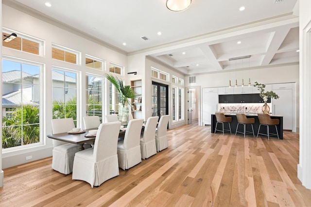 dining room featuring beamed ceiling, light wood-type flooring, french doors, and coffered ceiling