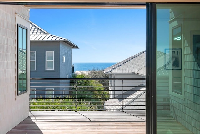 balcony featuring a water view