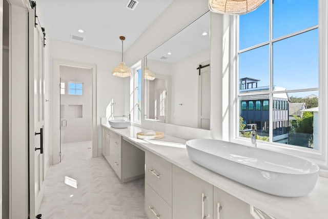 bathroom featuring vanity and an enclosed shower