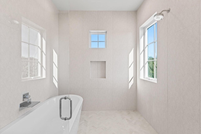 bathroom featuring a tub to relax in