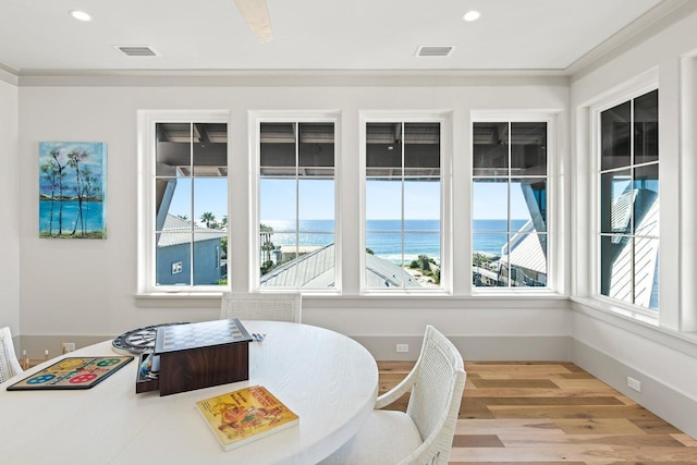 sunroom with a water view