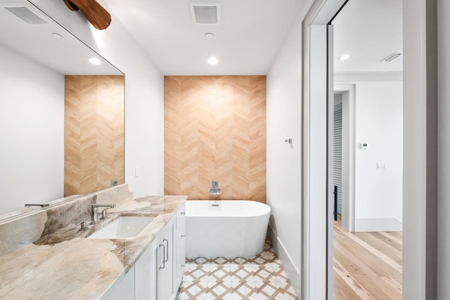 29 Thyme St, Santa Rosa Beach, FL 32459 - bathroom featuring vanity, a soaking tub, recessed lighting, and tile patterned floors