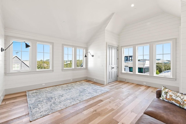 unfurnished sunroom with lofted ceiling