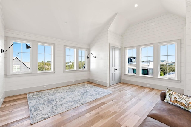 29 Thyme St, Santa Rosa Beach, FL 32459 - unfurnished room with lofted ceiling, light wood-style floors, and wood walls