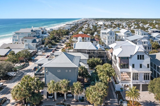 drone / aerial view with a water view and a view of the beach