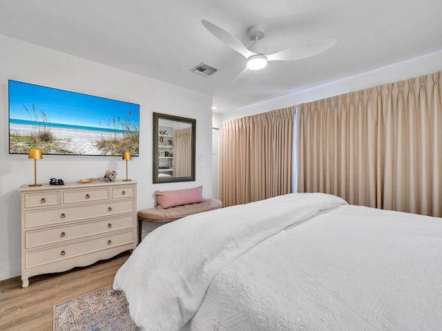 bedroom featuring light wood-type flooring and ceiling fan