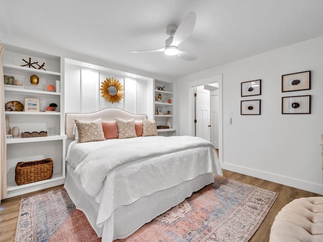 bedroom featuring dark hardwood / wood-style flooring and ceiling fan