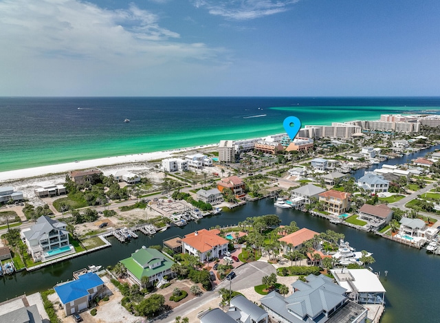 aerial view featuring a view of the beach and a water view