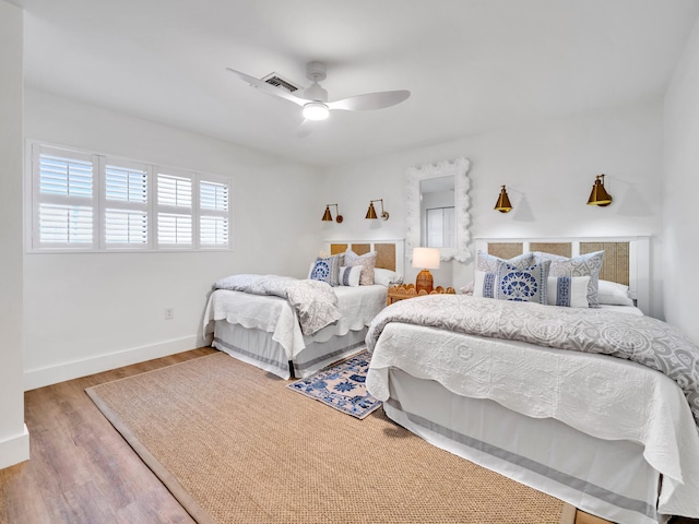 bedroom featuring ceiling fan and hardwood / wood-style floors