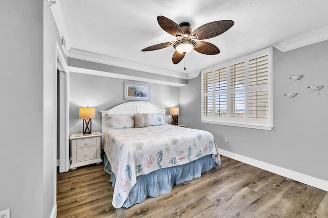 bedroom featuring ceiling fan, dark hardwood / wood-style floors, and ornamental molding