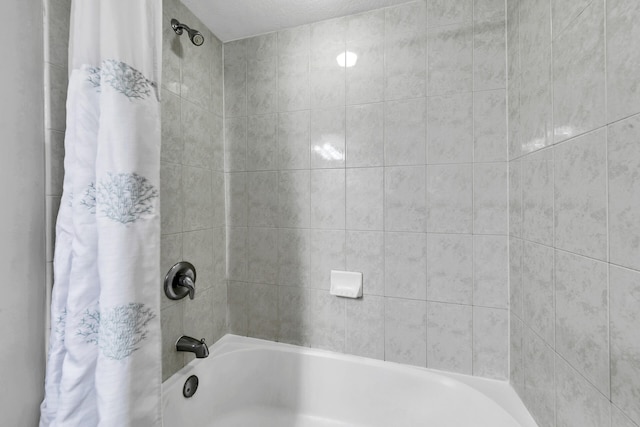 bathroom featuring shower / bathtub combination with curtain