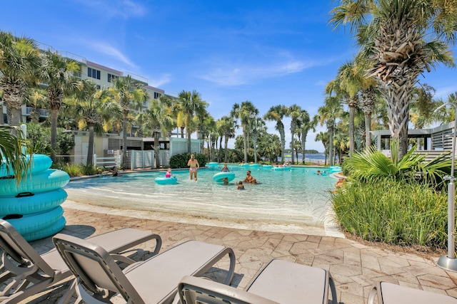 view of swimming pool with a patio area