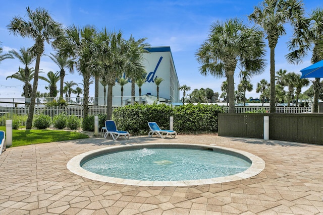 view of pool featuring a patio