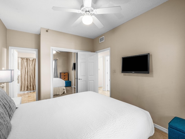 bedroom featuring a closet, ceiling fan, and ensuite bathroom