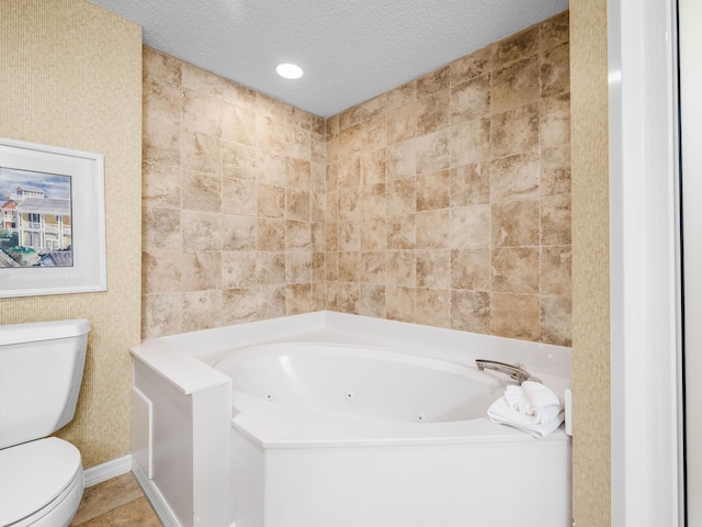 full bath with toilet, a tub with jets, tile patterned floors, a textured ceiling, and recessed lighting