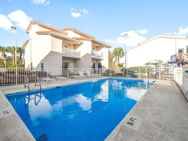 pool featuring fence