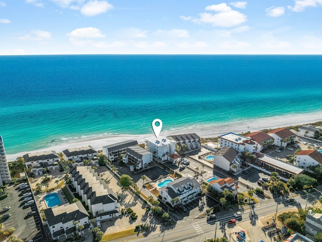 drone / aerial view with a water view and a view of the beach